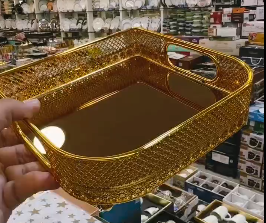 Metallic golden tray with golden glass on base