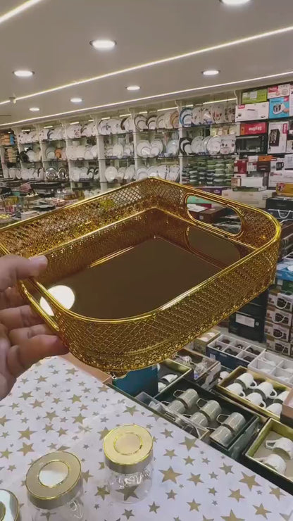 Metallic golden tray with golden glass on base