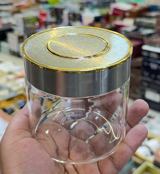 Push button golden-steel and white-ceramic look jar